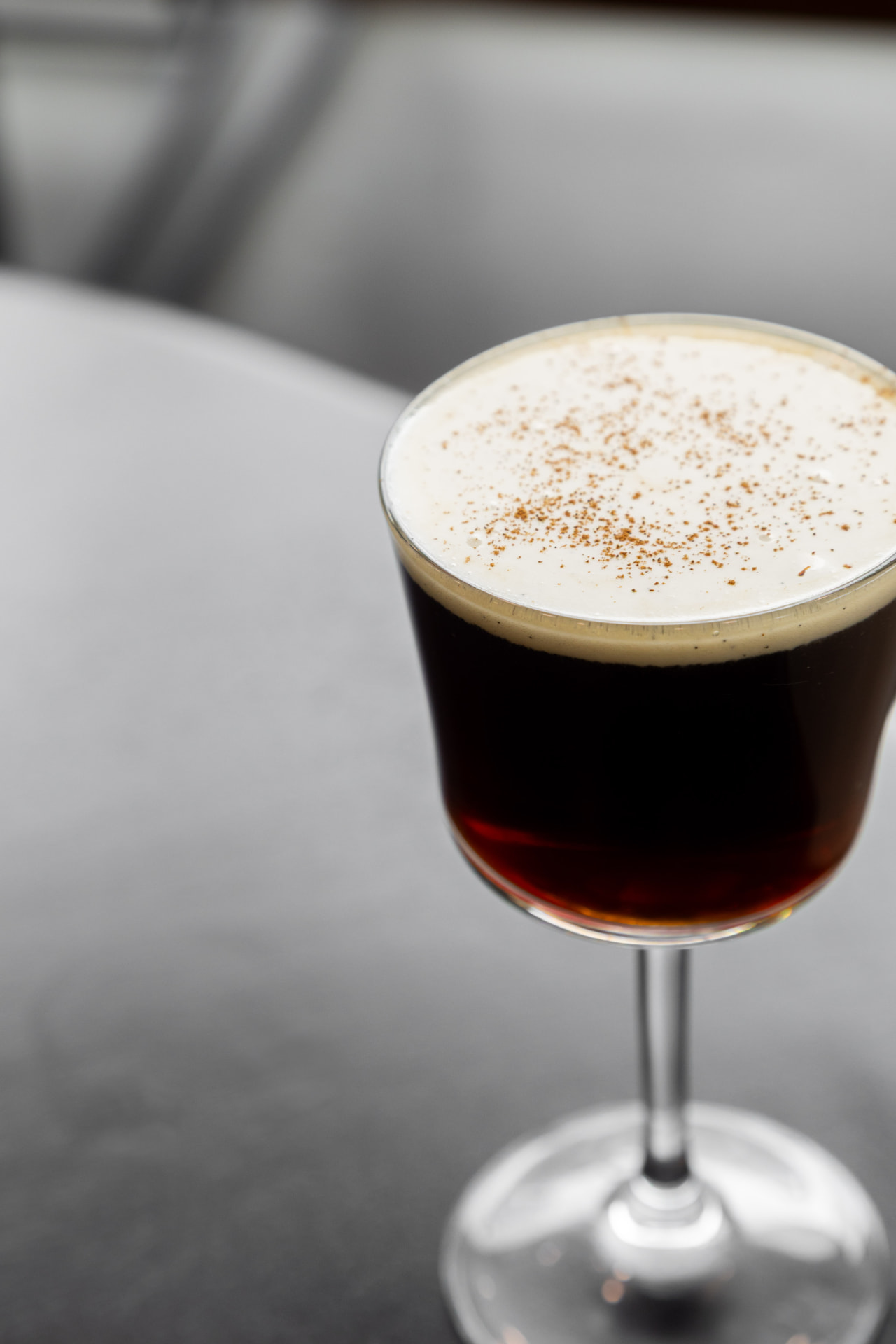 DUO Irish Coffee with a cream topping in a stemmed glass